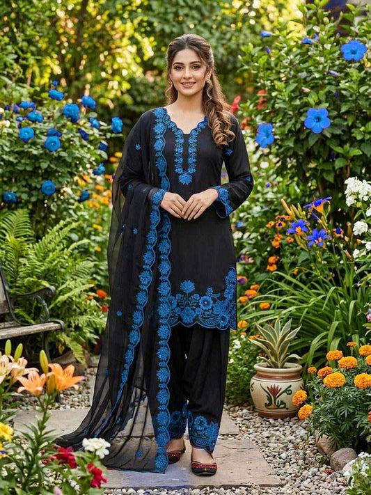 Side profile view of a blue traditional ensemble showcasing the lightweight semi transparent drape of the premium organza dupatta.