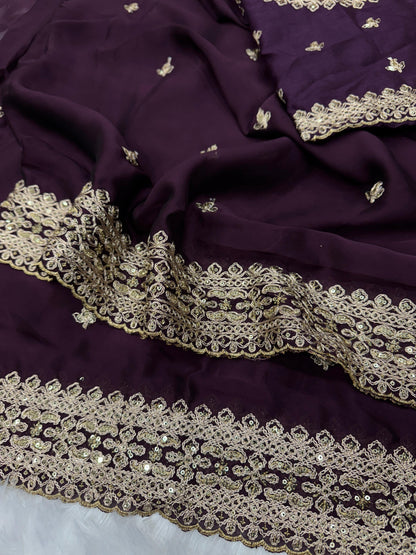 Close-up of wine Rangoli silk fabric texture with intricate sequins and dori embroidery - WishTown Fashion Club