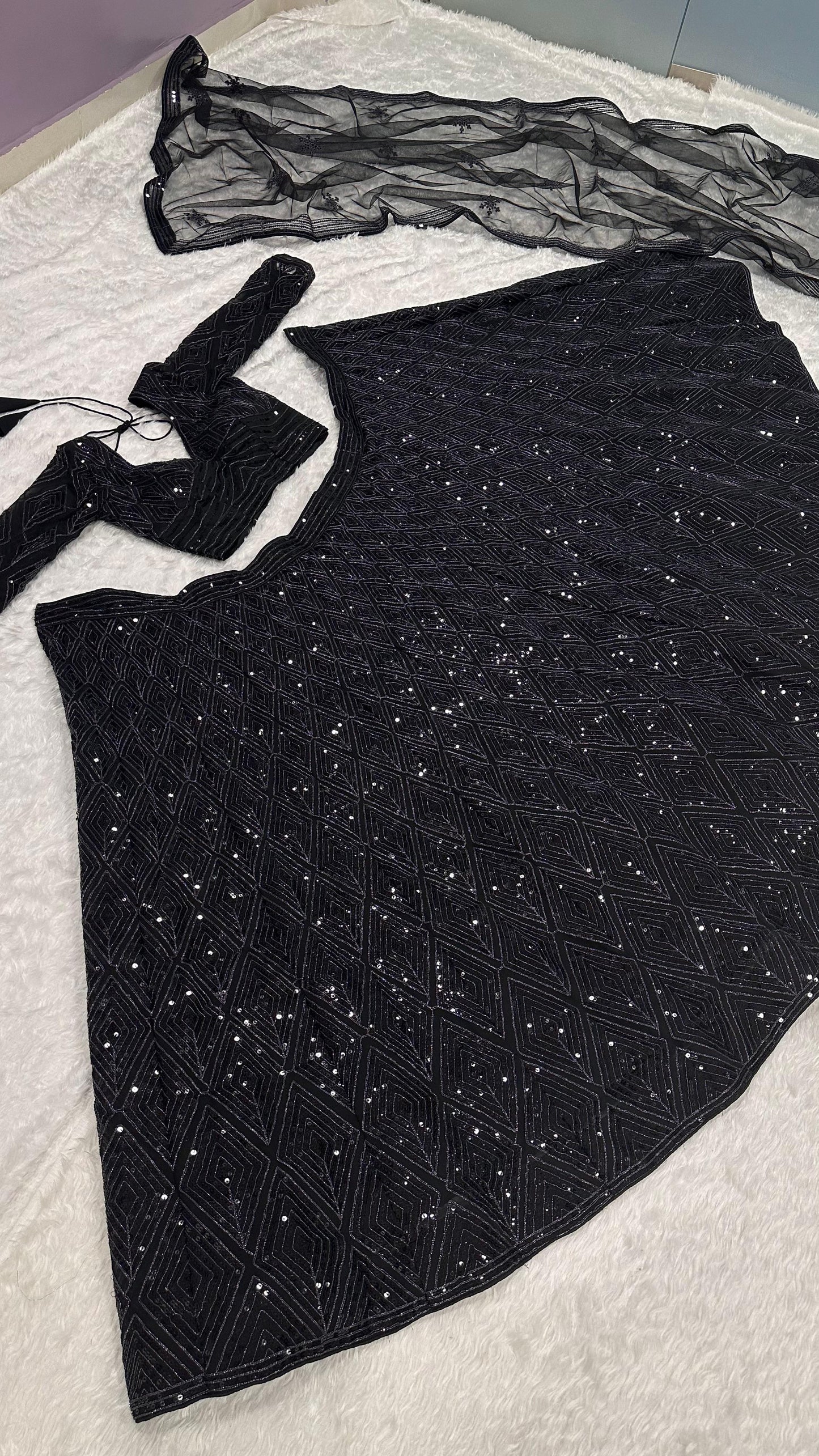 Black festive wear lehenga with unstitched embroidered blouse and net dupatta - WishTown Fashion Club