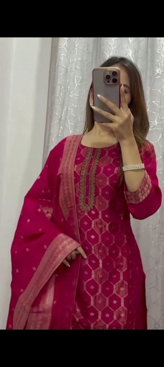 Woman taking mirror selfie wearing a pink ethnic fusion wear with geometric patterns and matching dupatta