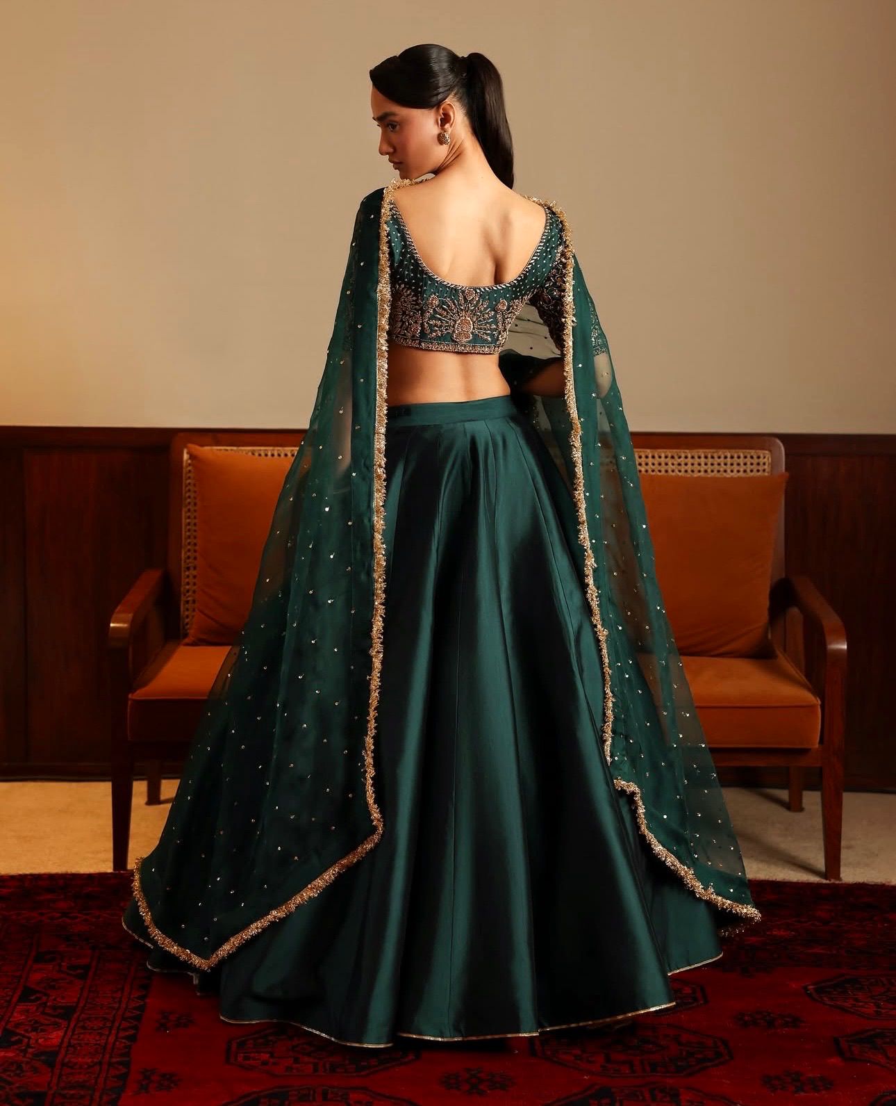 Women’s green satin lehenga set featuring sequins and zari embroidered blouse with stone-work dupatta – WishTown Fashion Club