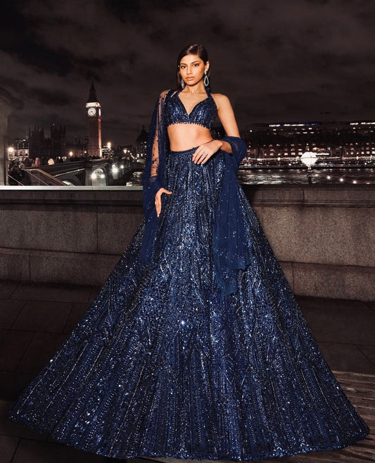 Navy net lehenga with sequins and dori embroidery paired with matching embroidered blouse and dupatta – WishTown Fashion Club