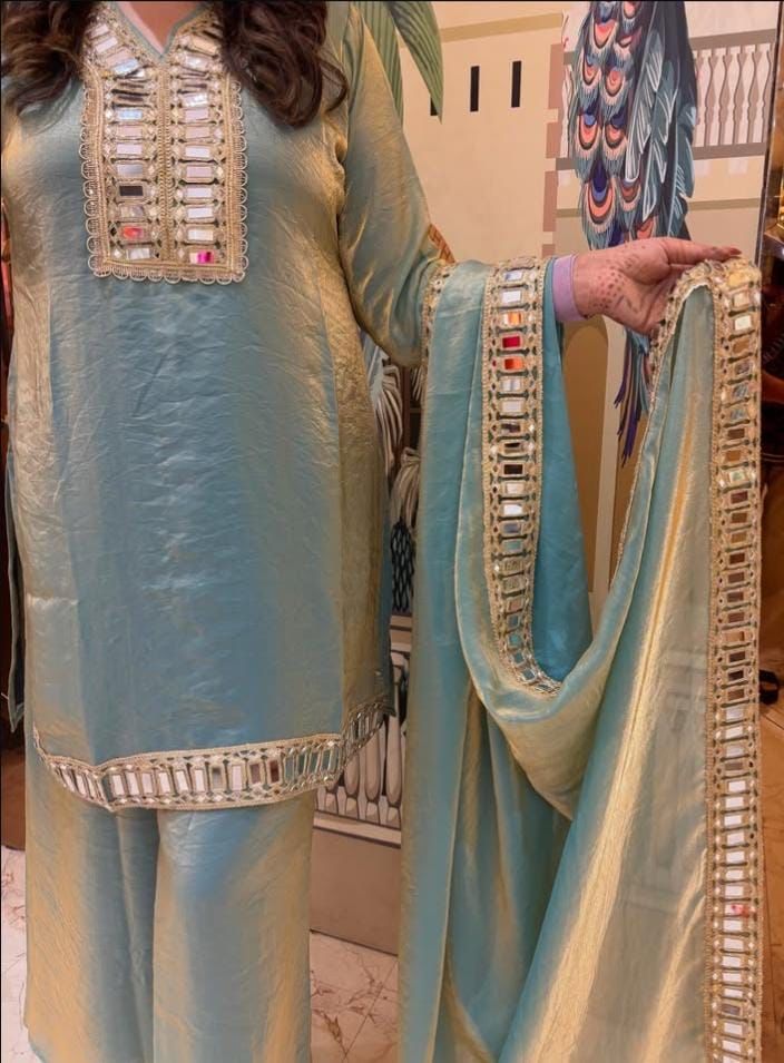 C green fendy silk ethnic wear with shimmering mirror work side view - WishTown Fashion Club