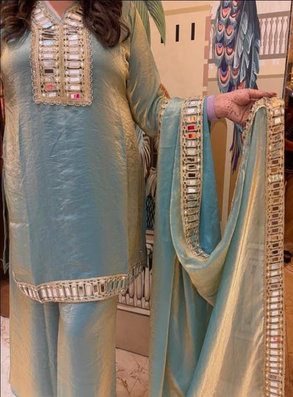 C green fendy silk ethnic wear with shimmering mirror work side view - WishTown Fashion Club