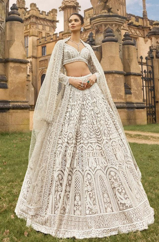 White net lehenga with sequins dori and thread embroidery front view - WishTown Fashion Club