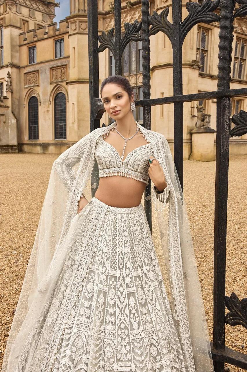 White bridal wear net lehenga with pearl border blouse and dupatta - WishTown Fashion Club