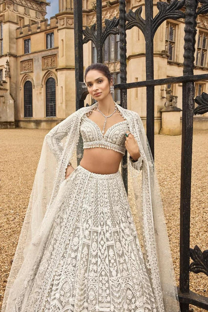 White bridal wear net lehenga with pearl border blouse and dupatta - WishTown Fashion Club