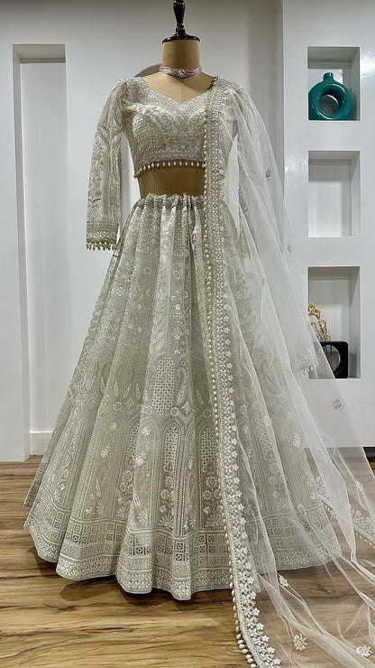 White wedding wear net lehenga fabric texture and craftsmanship close-up - WishTown Fashion Club