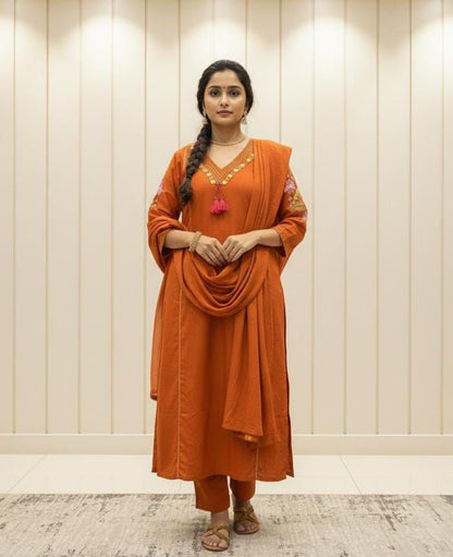 Orange cotton straight suit set with embroidered V-neck kurta front view - WishTown Fashion Club