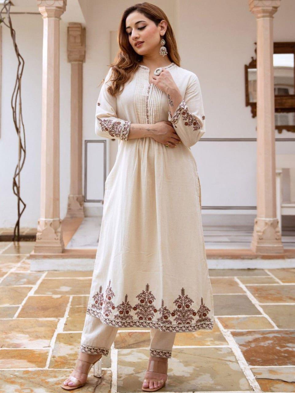 Off white cotton flex kurti pant set with thread embroidery front view - WishTown Fashion Club