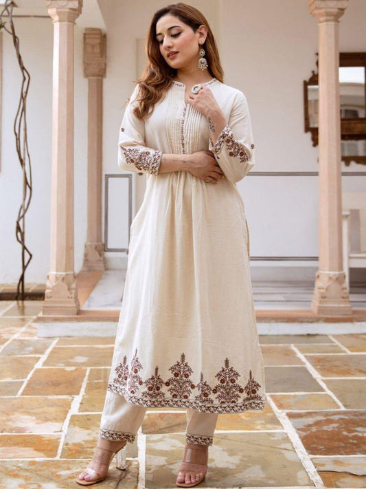 Off white cotton flex kurti pant set with thread embroidery front view - WishTown Fashion Club