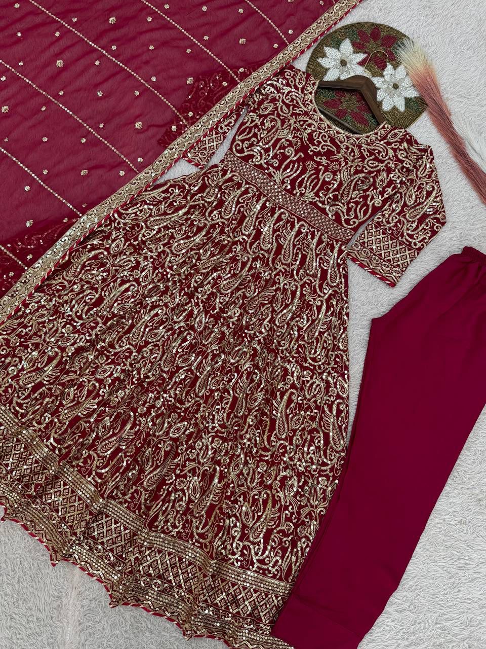 Maroon wedding wear embroidered gown with stitched cups detailed look - WishTown Fashion Club