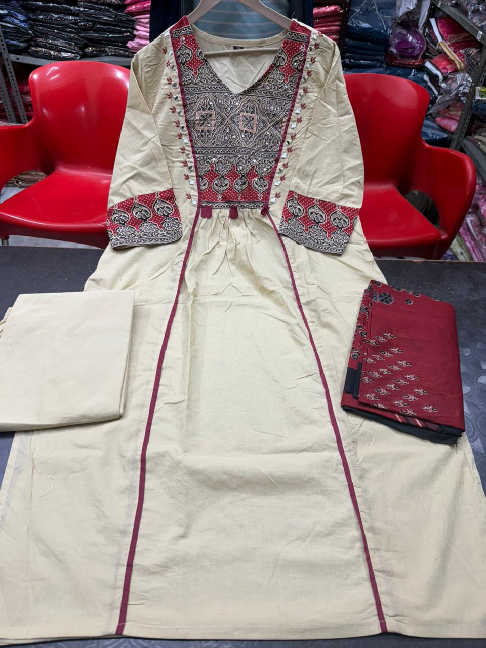 Off white cotton designer kurti pant set with traditional adda work close up - WishTown Fashion Club