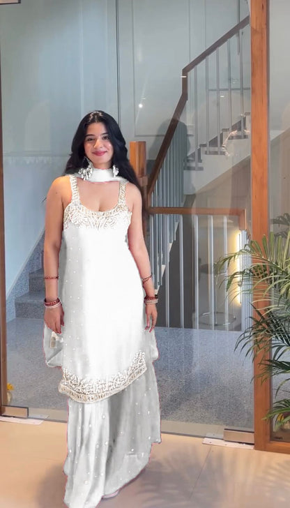 White faux georgette sharara set with elegant embroidery work - WishTown Fashion Club
