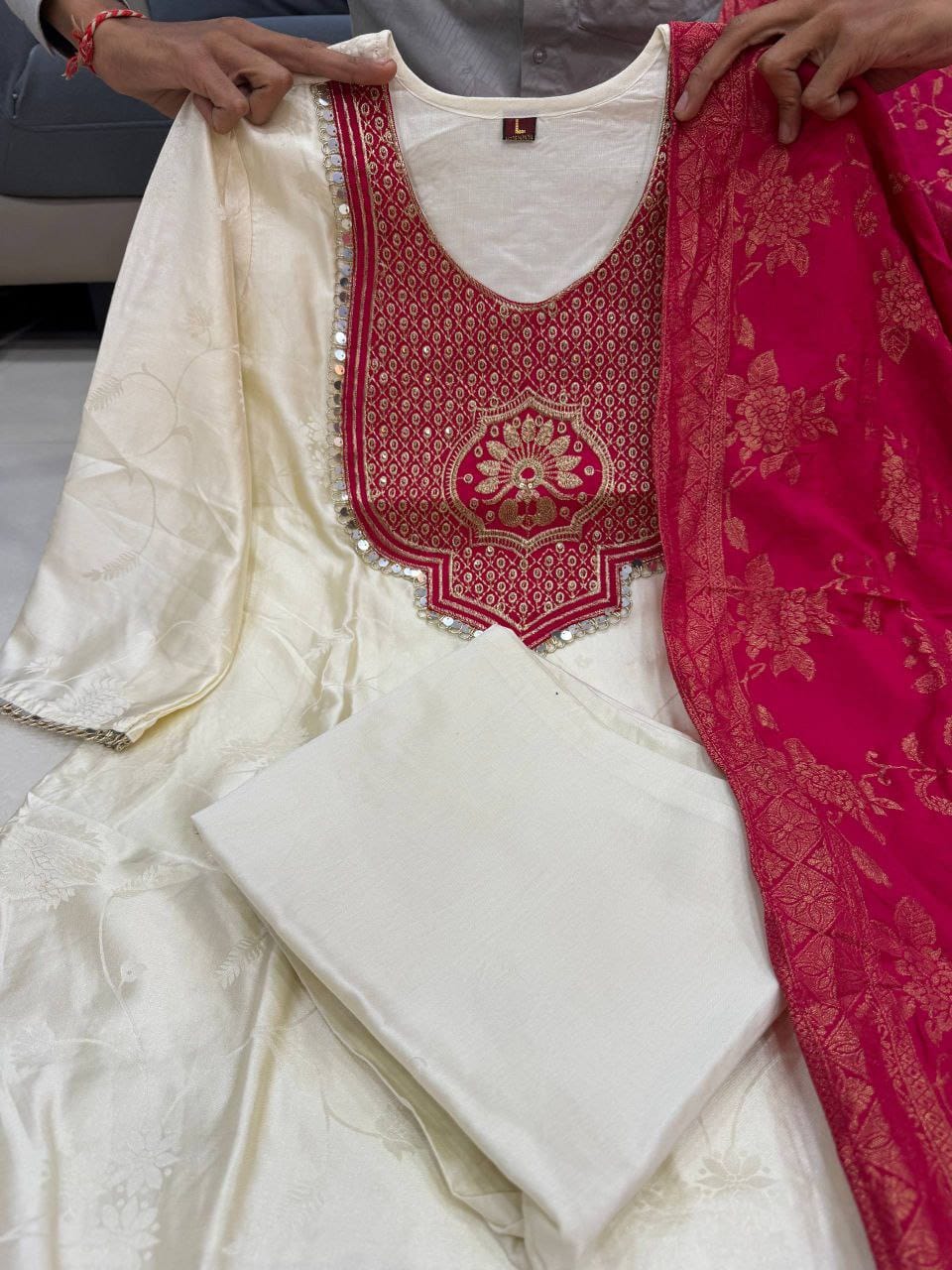 Off white festive Banarasi suit set with hand zari weaving and elegant ethnic design - WishTown Fashion Club