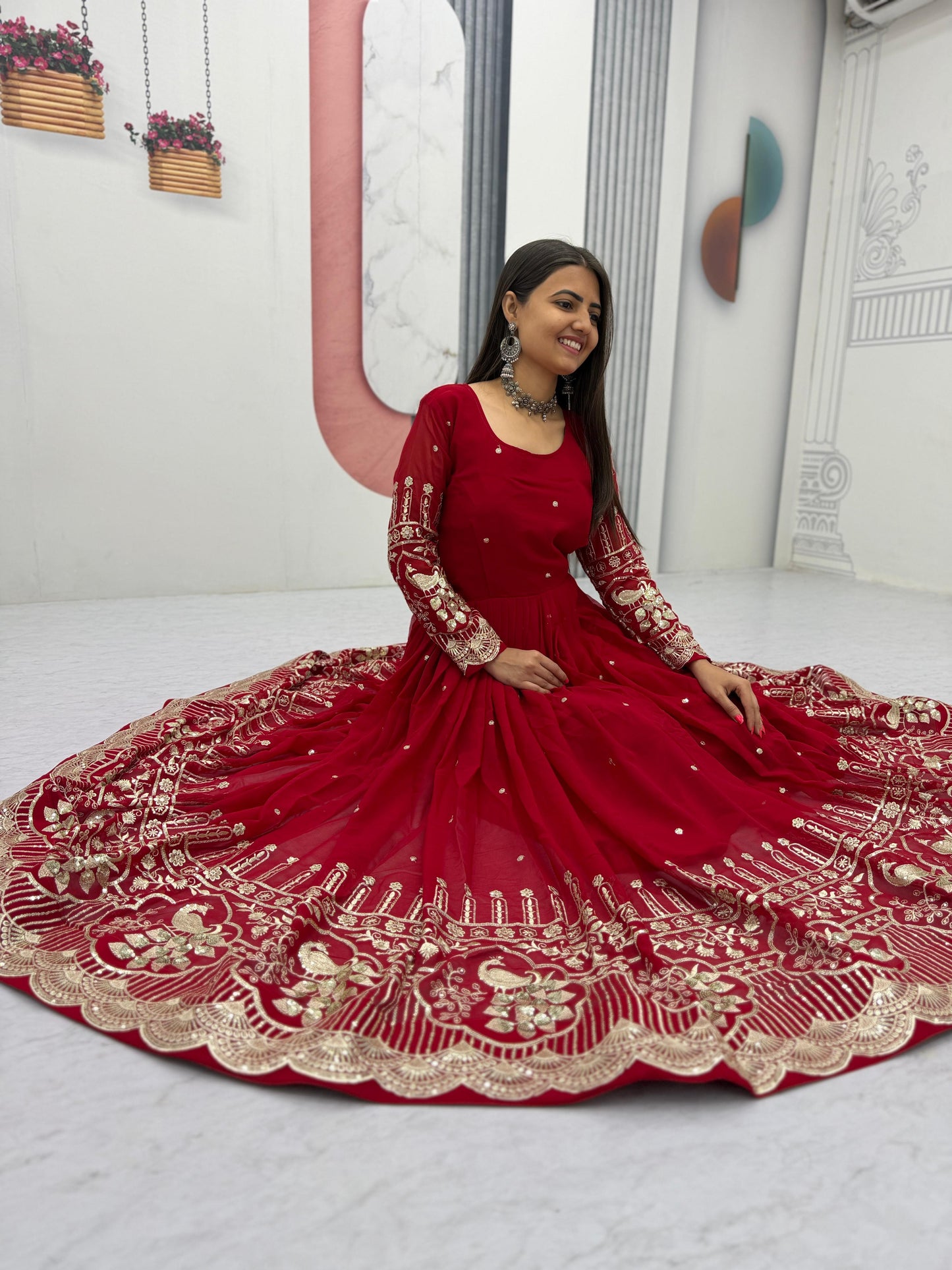 Red elegant partywear gown with heavy embroidery and flowing flair - WishTown Fashion Club