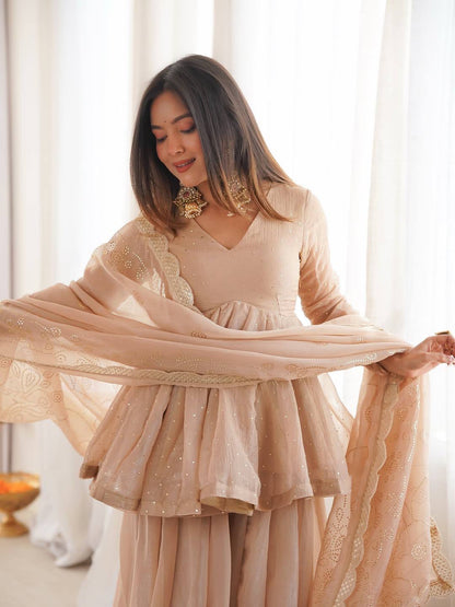 Beige ethnic wear organza sharara suit with elegant mukaish detailing close look - WishTown Fashion Club