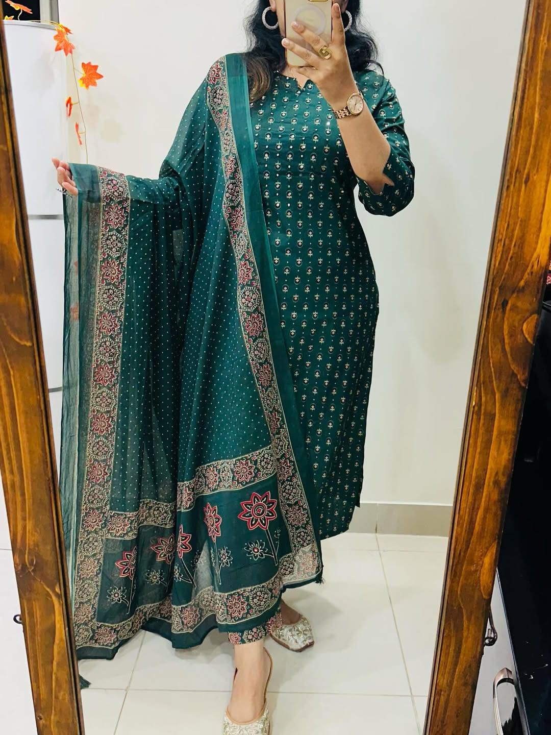 Back perspective of fully stitched teal green ethnic suit highlighting the comfortable straight silhouette and soft texture.