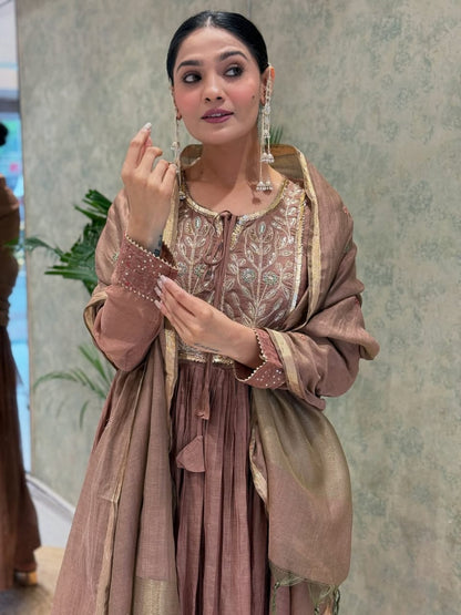 Back angle presentation of a fully stitched rosy brown traditional outfit highlighting the clean tailoring and premium material texture.