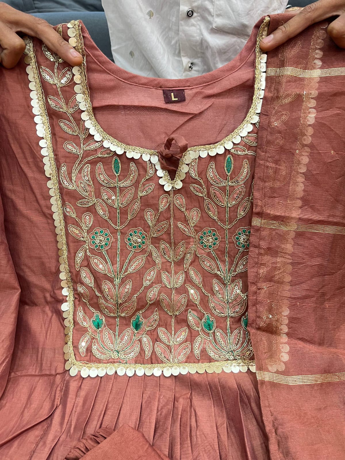 Side perspective highlighting the graceful flowing flare and elegant silhouette of a rosy brown festive anarkali tunic.