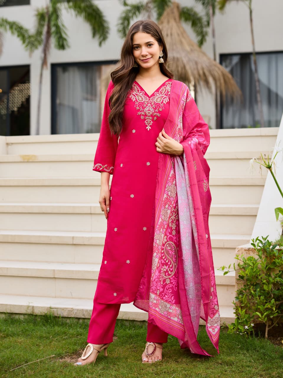 Back angle presentation of the fully stitched pink traditional suit showing clean tailored seams and a comfortable lining drape.