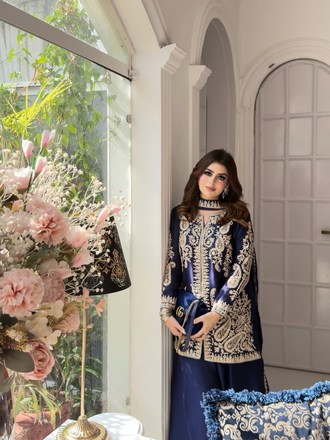 Back angle presentation of the stitched navy blue traditional outfit showing clean tailored seams and a graceful fabric drape.