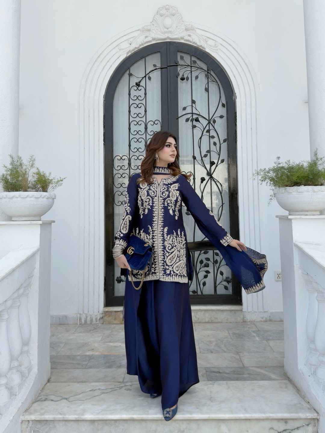 Detailed shot of the comfortable wide leg navy blue palazzo trousers displaying the loose free size silhouette and micro interior lining.