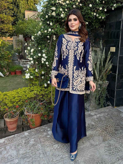 Front view of full three piece navy blue traditional festive outfit featuring an embroidered silk tunic top and wide leg palazzo trousers.