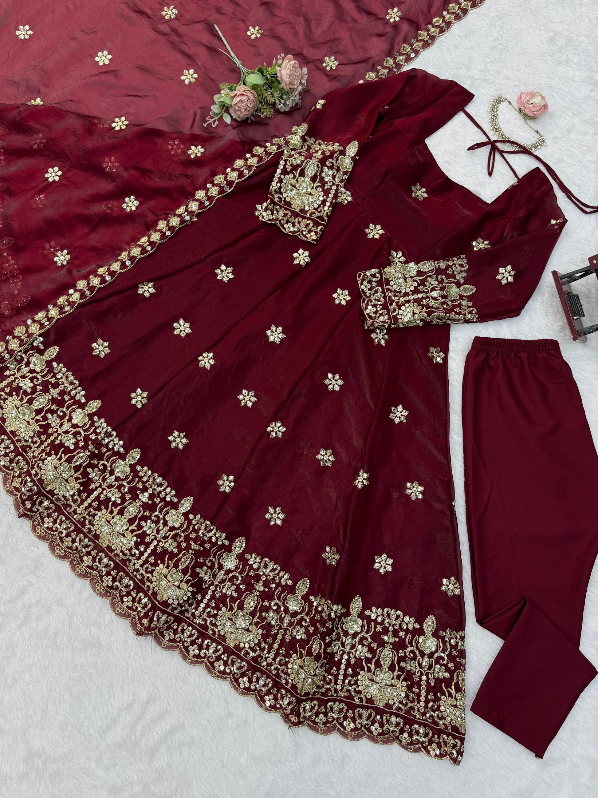 High resolution view of a maroon fendy silk dupatta scarf displaying detailed sequin borders and elegant two side cutwork patterns.