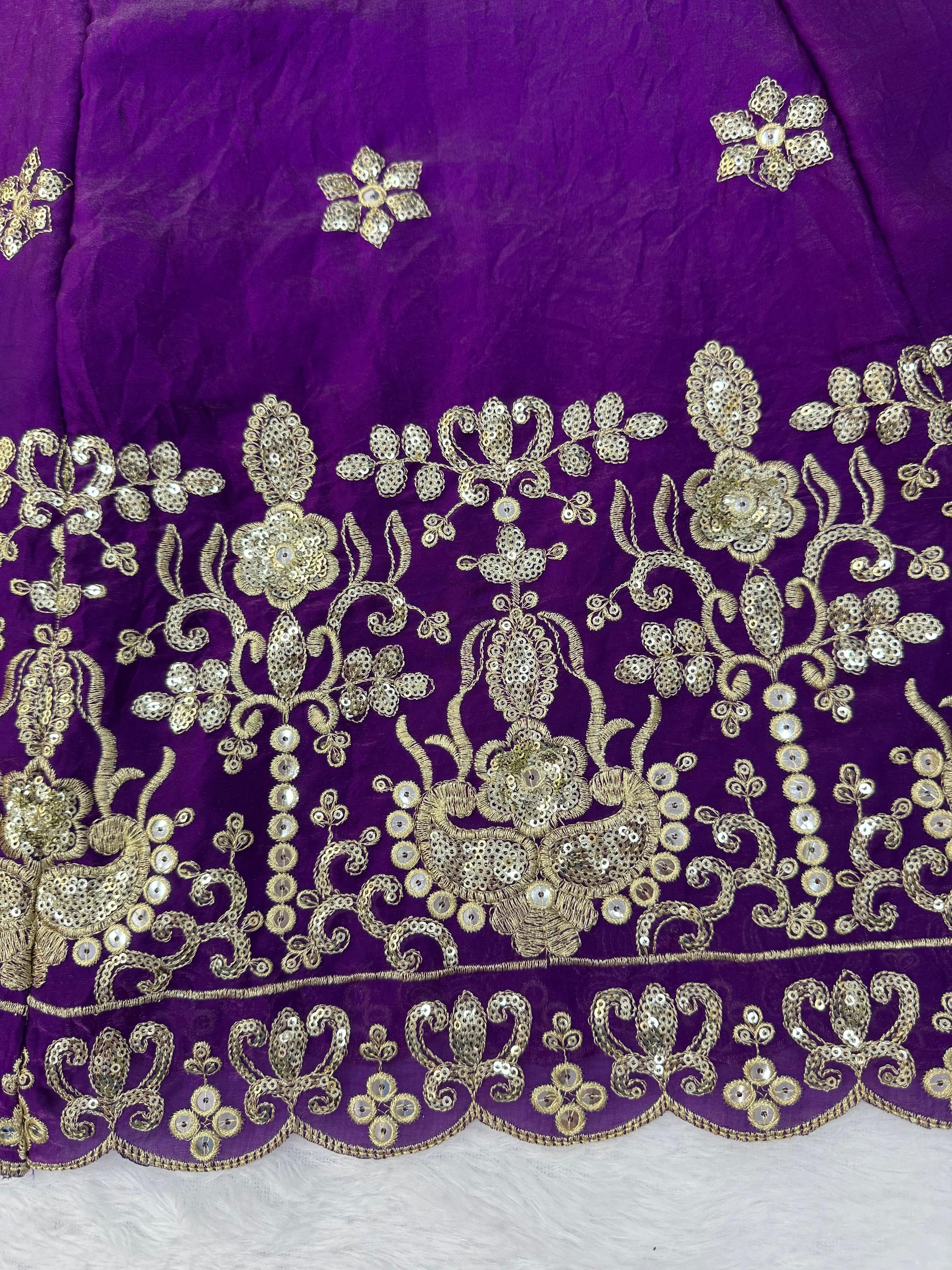 Swirling side profile view showing the generous fifty two inch length and voluminous structural flow of a purple festive gown.