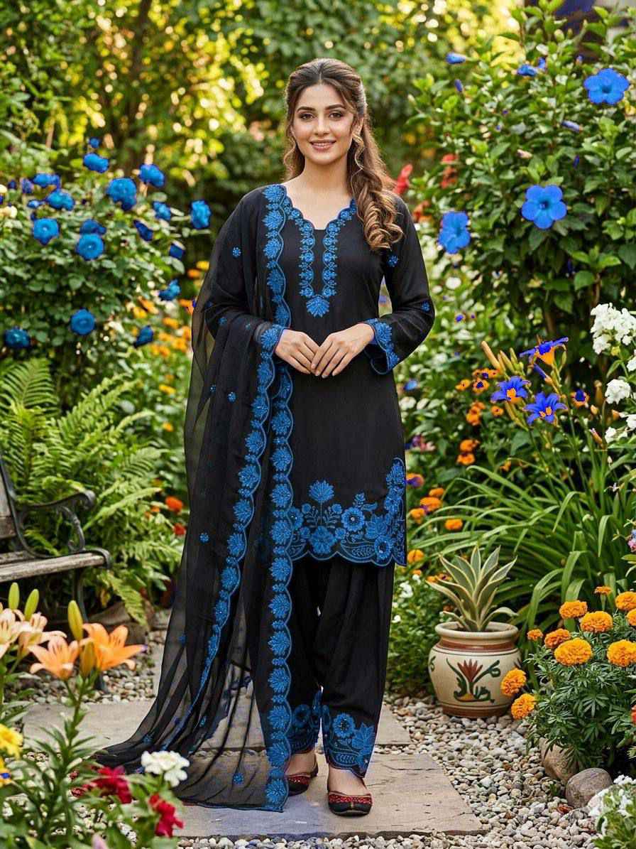 Side profile view of a blue traditional ensemble showcasing the lightweight semi transparent drape of the premium organza dupatta.