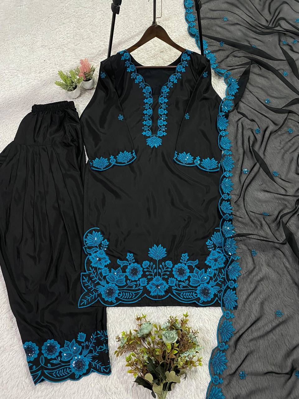 Elegant navy blue cultural outfit displayed cleanly on a flat surface to showcase the forty inch top length proportions.