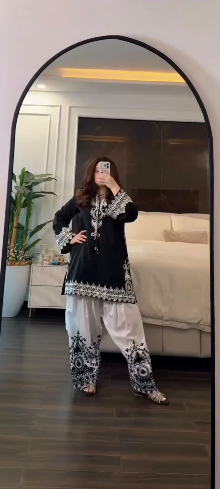 Complete flat layout presentation of the black designer suit set displaying the three separate garment pieces including top pants and printed scarf.