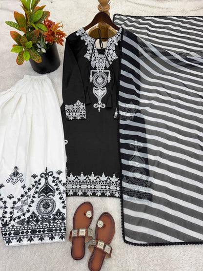 Side perspective of a fully stitched black ethnic dress highlighting the elegant full length sleeves and flowing digital printed georgette dupatta.