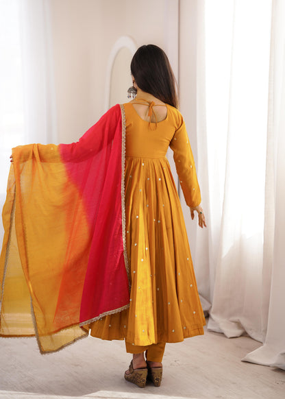 Complete flat layout presentation of the designer mustard yellow suit set displaying the three separate pieces including gown pants and scarf.