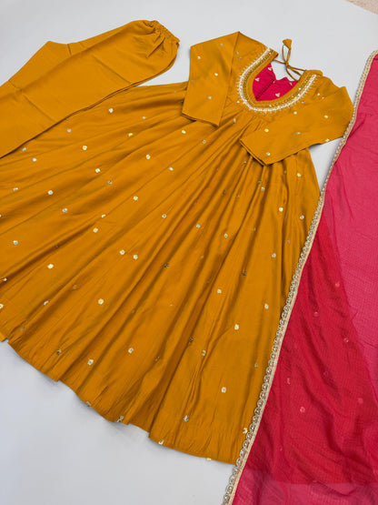 Complete flat layout presentation of the designer mustard yellow suit set displaying the three separate pieces including gown pants and scarf.