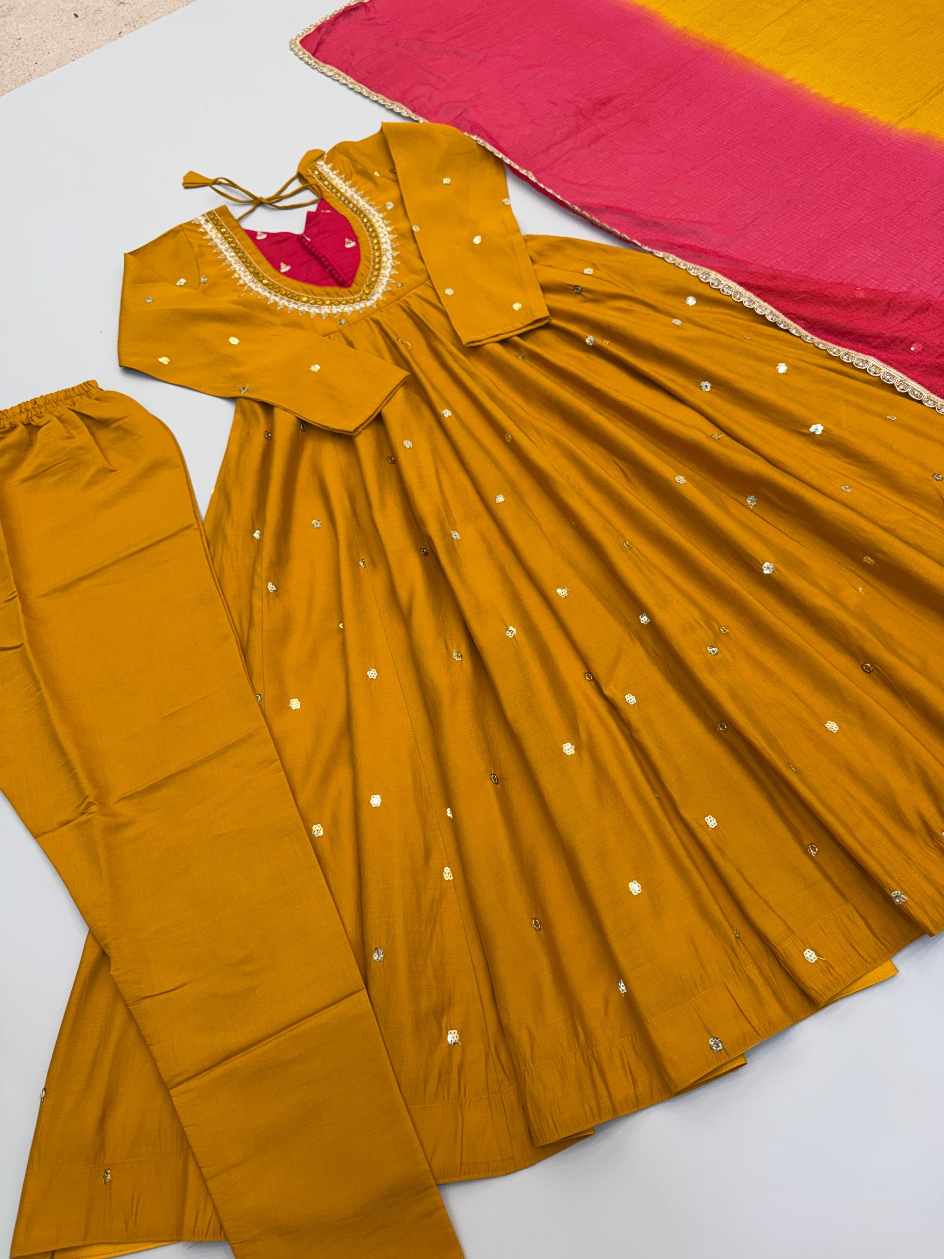 High resolution view of a mustard yellow kota checks dupatta scarf showing beautiful multi color digital print patterns and lace borders.
