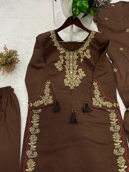 Flat layout display of a dark chocolate brown printed tunic matching trousers with embroidered borders and a long scarf.