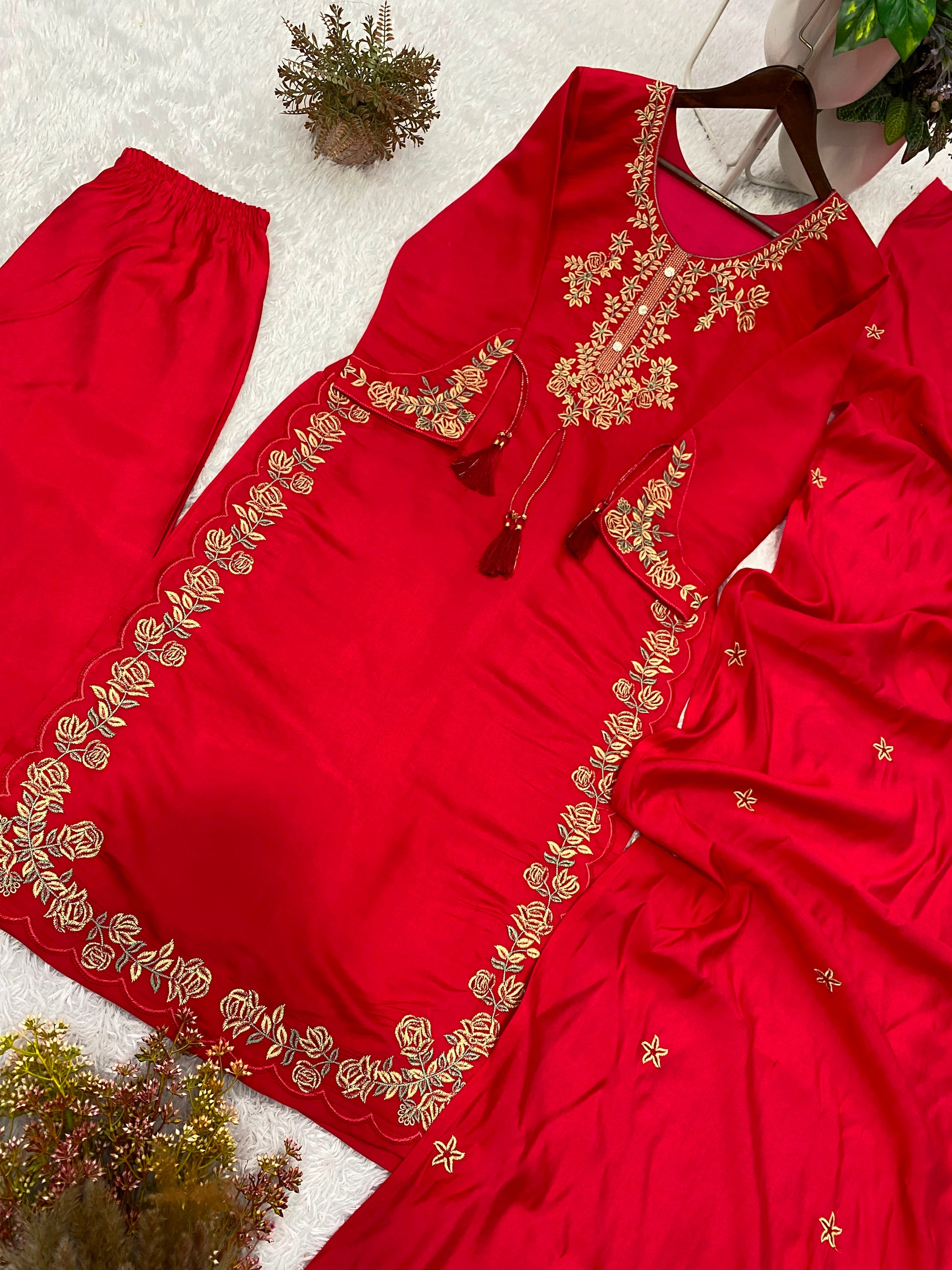 Flowing side angle of a stitched maroon traditional dress highlighting the soft micro interior lining comfort and tailored height.
