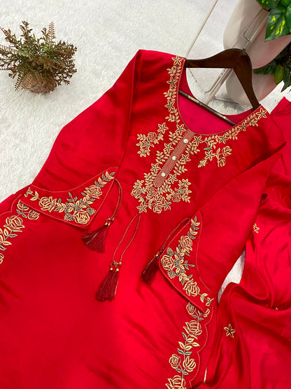 Elegant maroon fabric dupatta scarf with traditional embroidered borders displayed clearly on a flat solid background.