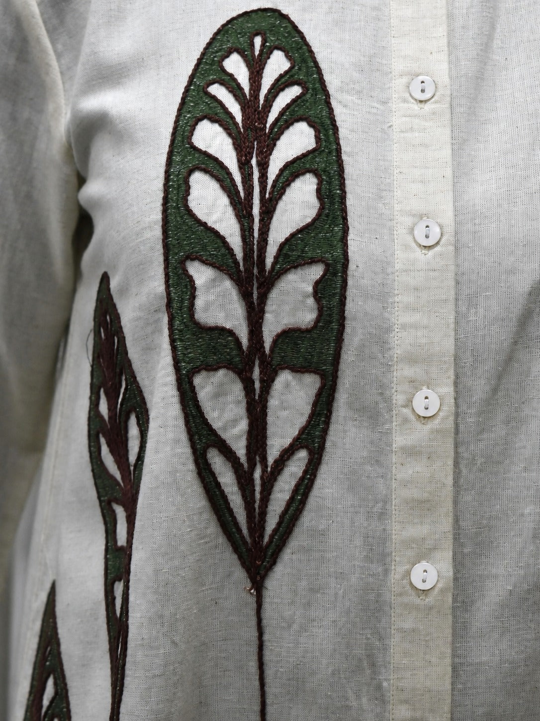 Back angle presentation of the green cotton flex top showing the continuous solid color layout and clean seamless structure lines.