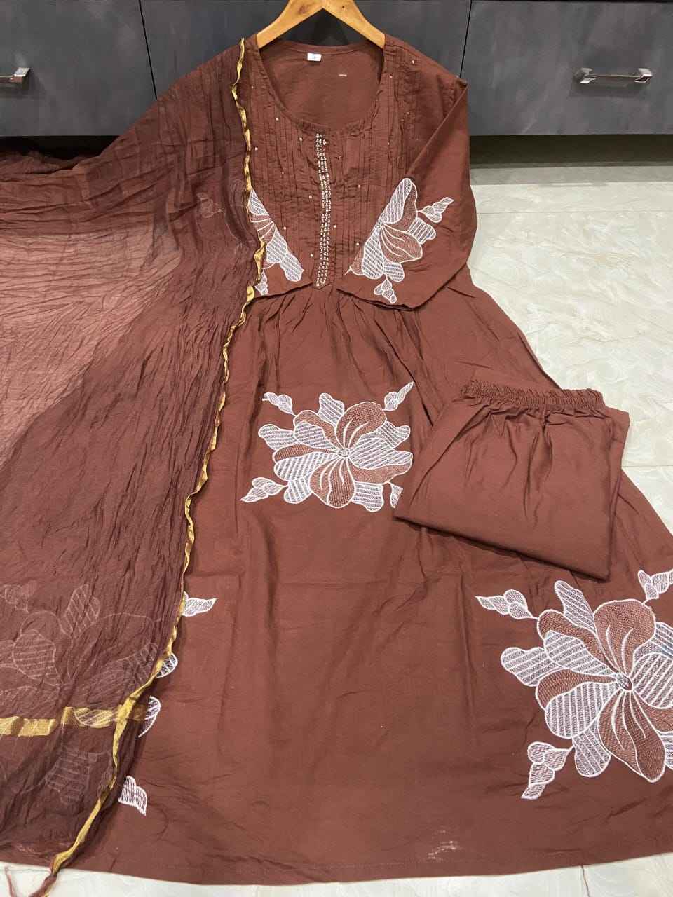 Side perspective presentation of the fully stitched brown ethnic tunic highlighting the premium clean seams and comfortable straight regular layout line.