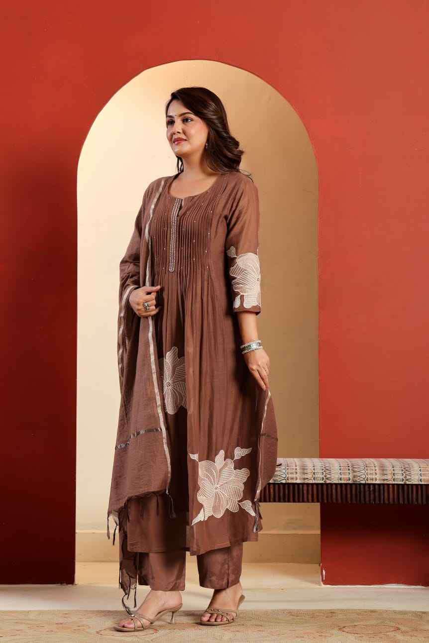 Detailed view of the brown kurti sleeves displaying the fine matching continuous embroidered work along the arm length and cuffs.