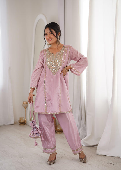 Complete flat layout presentation of the pink designer suit set displaying the short tunic top pants and matching batwa bag together.