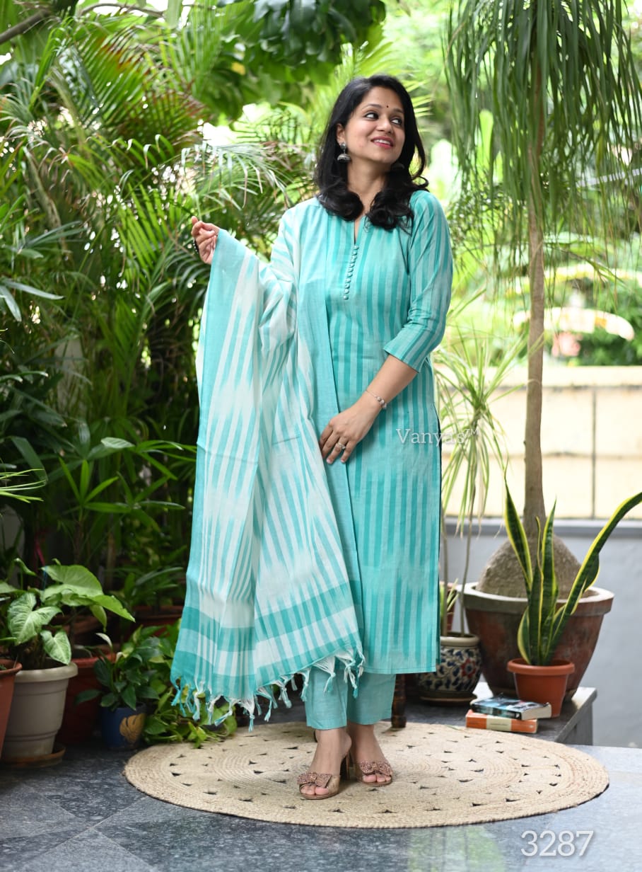 Front view of full three piece sky blue south cotton handloom kurta set displaying a weaving cotton tunic straight pants and matching dupatta.