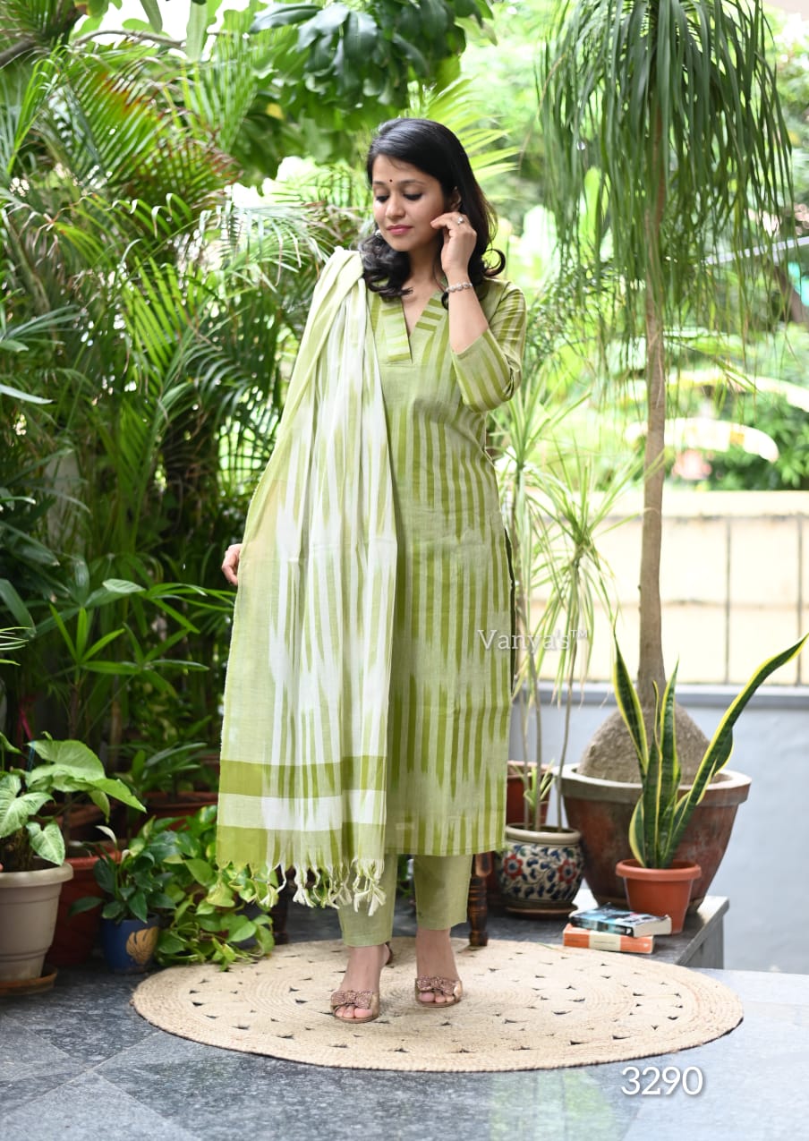 ront view of full three piece green south cotton handloom kurta set displaying a weaving cotton tunic straight pants and matching dupatta.