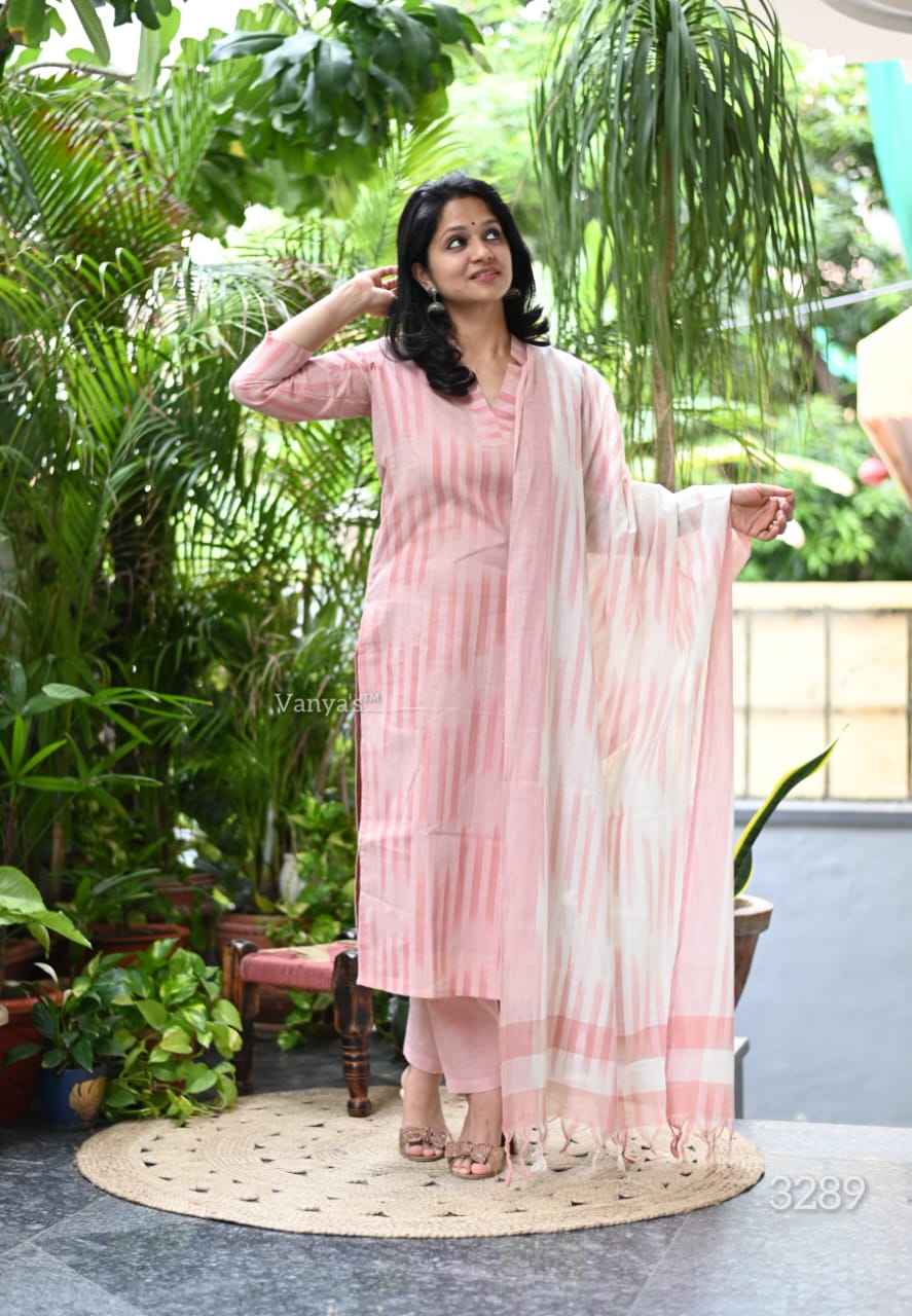 Front view of full three piece dusty rose south cotton handloom kurta set displaying a weaving cotton tunic straight pants and matching dupatta.