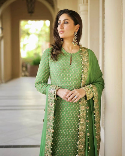 Complete flat layout presentation of the green designer suit set showing the three separate pieces including kurti palazzo and long scarf.
