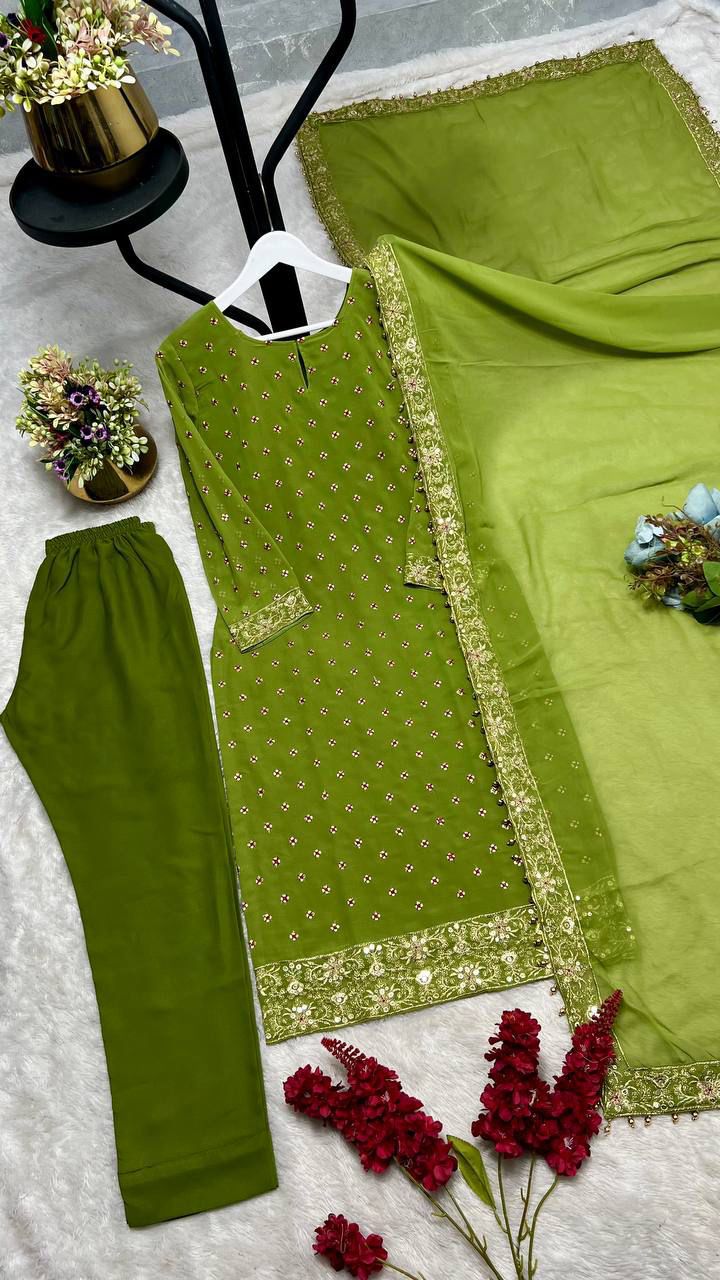 Back angle presentation of the green ethnic kurti showcasing identical intricate sequence work and clean tailoring lines.