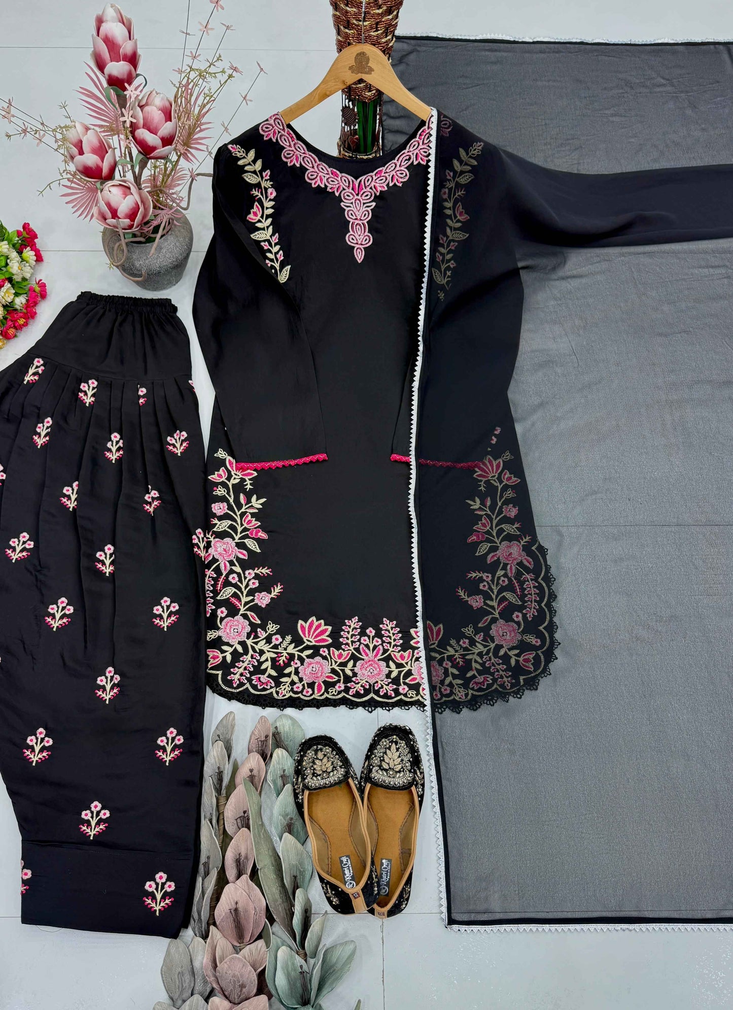 High resolution view of a black faux georgette dupatta scarf displaying a matching four side fancy lace border on a solid canvas.